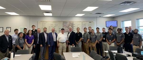 Chancellor Perdue on the Eastman Campus with aviation students and faculty.